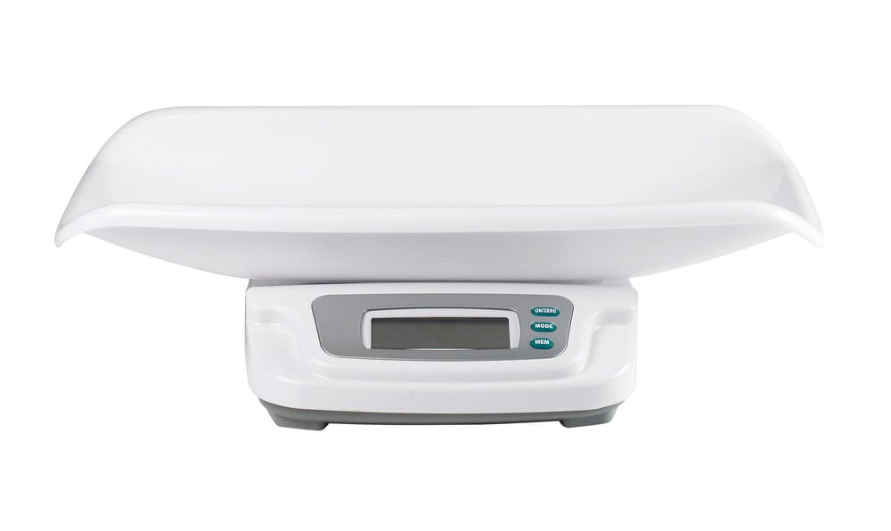 Digital baby scale with a curved white tray on top and a digital display beneath, set against a plain white background, reminding us of the importance of electronics recycling to ensure sustainability in an increasingly digital world.