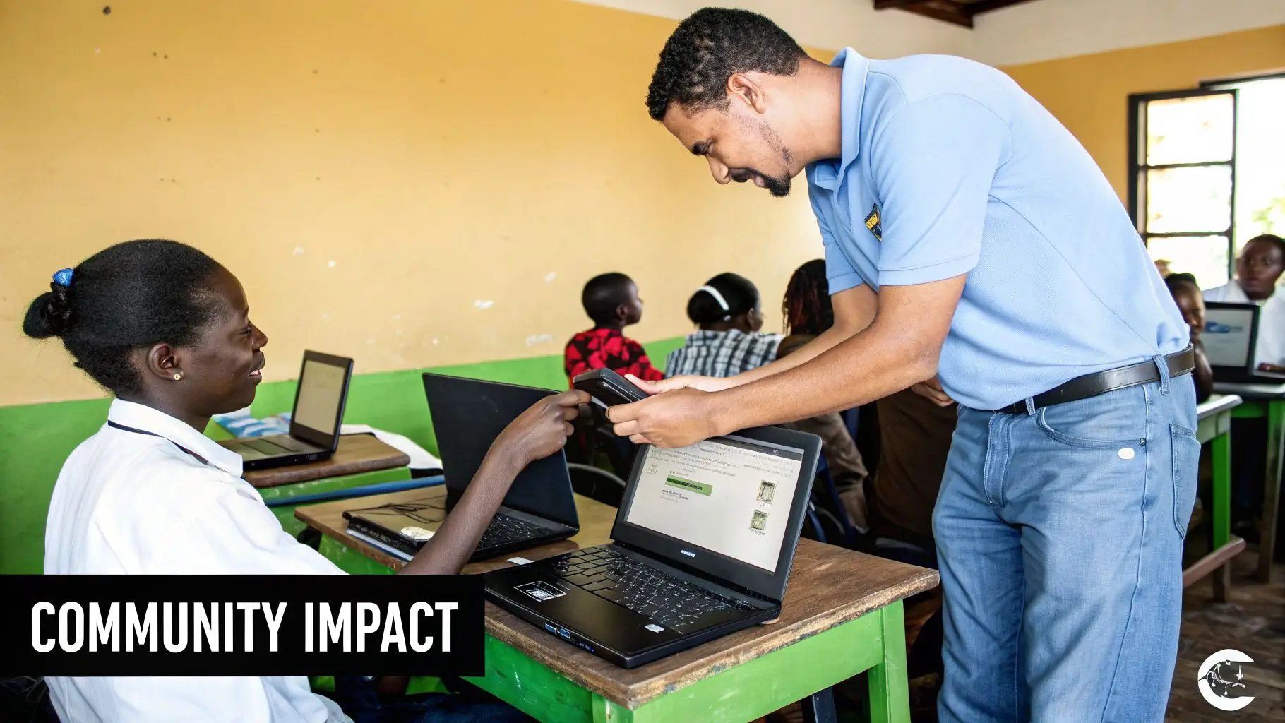 A man assists a young woman using a laptop in a classroom, demonstrating technology's community impact.