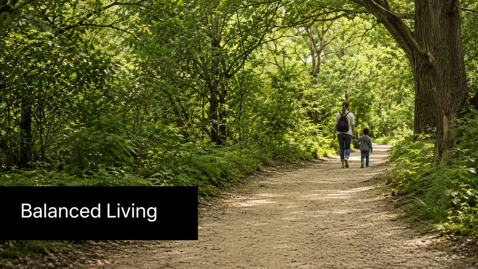 A mother holding her young child's hand while walking along a scenic dirt path through a forest.
